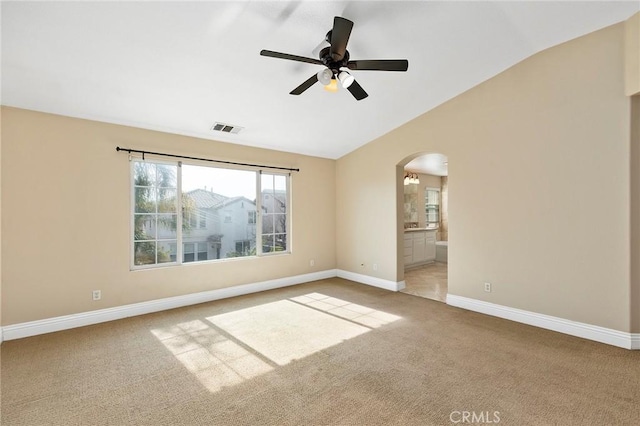 unfurnished room featuring lofted ceiling, carpet floors, and ceiling fan