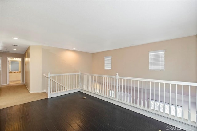 unfurnished room with wood-type flooring