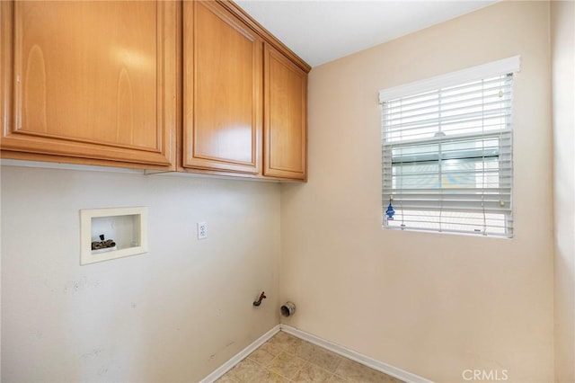 laundry room featuring washer hookup and cabinets