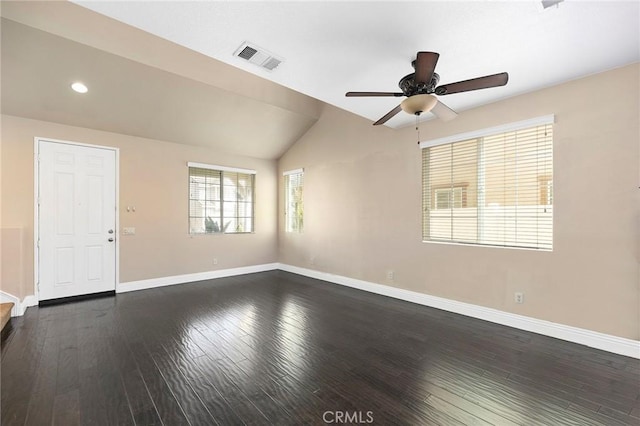 empty room featuring ceiling fan, lofted ceiling, and dark hardwood / wood-style flooring