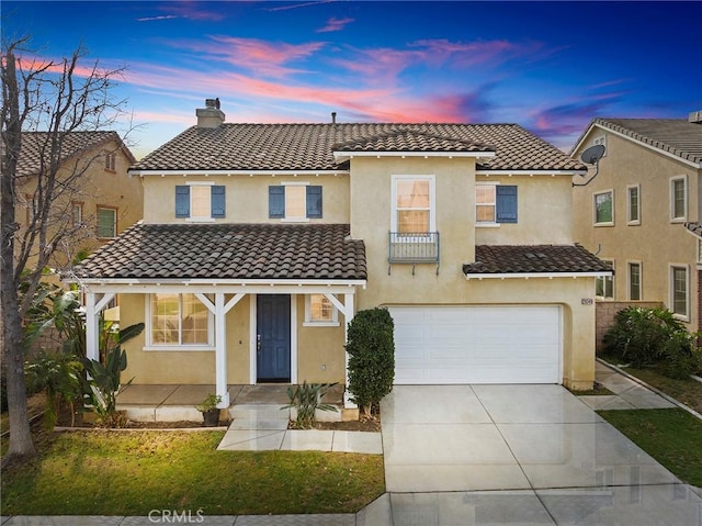 mediterranean / spanish-style house with a garage