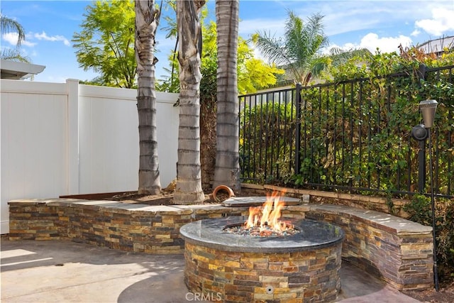 view of patio featuring a fire pit