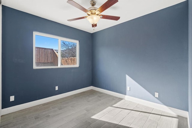 empty room featuring light hardwood / wood-style floors and ceiling fan