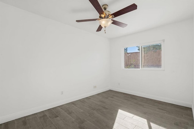 spare room with ceiling fan and wood-type flooring