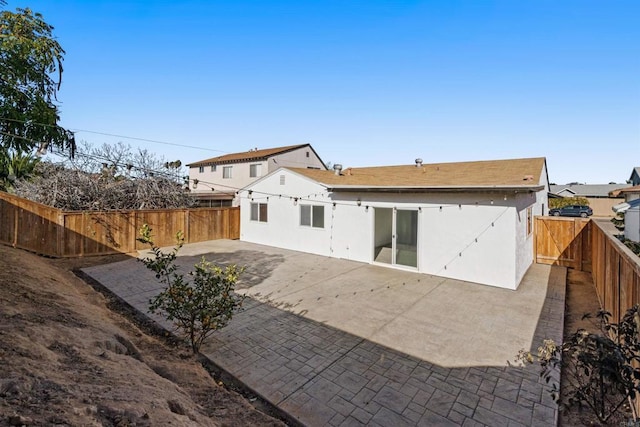 back of property featuring a patio