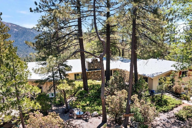 view of side of property with a mountain view