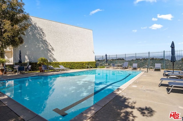 view of pool featuring a patio area