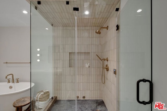 bathroom featuring plus walk in shower