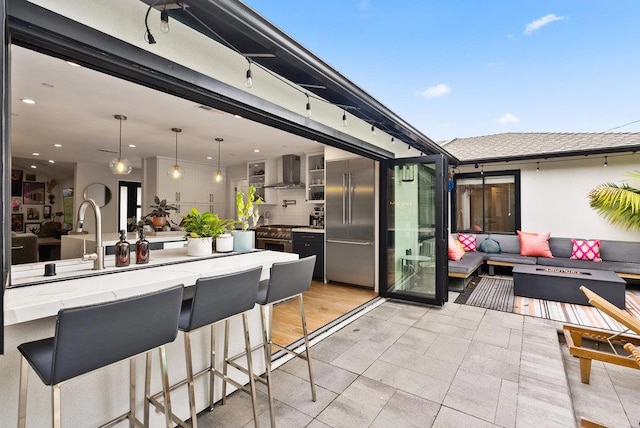 view of patio with a fire pit and a bar