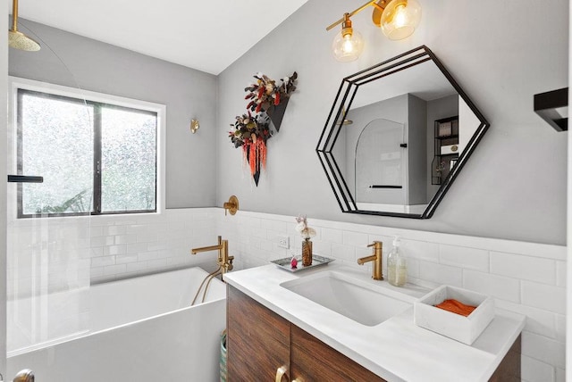 bathroom with vanity and a tub