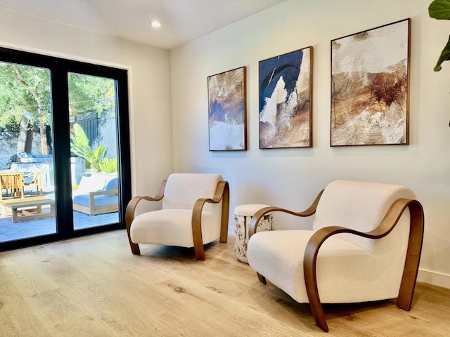 sitting room with light hardwood / wood-style floors