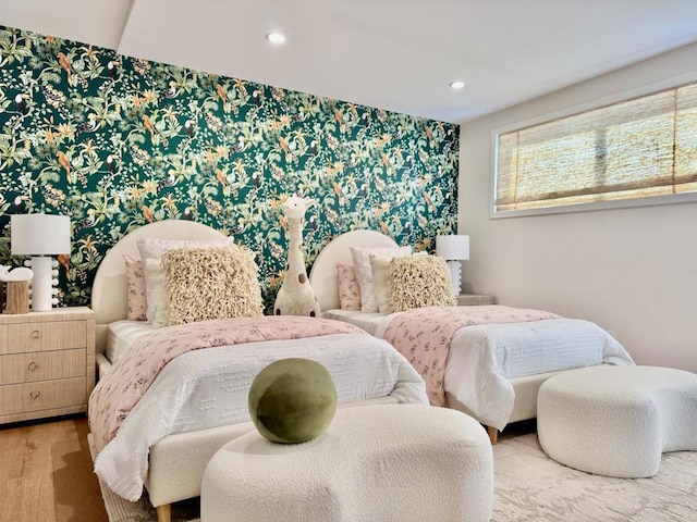 bedroom with hardwood / wood-style flooring