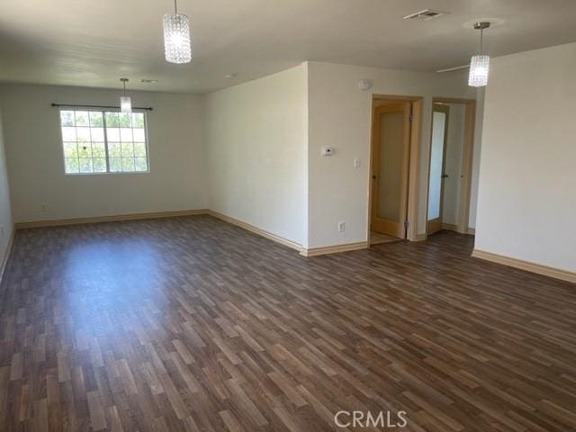 spare room featuring dark hardwood / wood-style floors