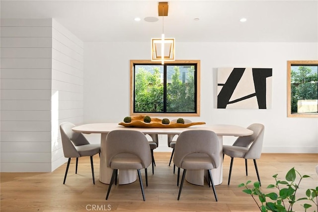 dining area featuring light wood-style floors, recessed lighting, and baseboards