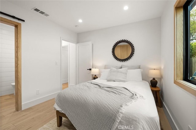 bedroom featuring light hardwood / wood-style floors