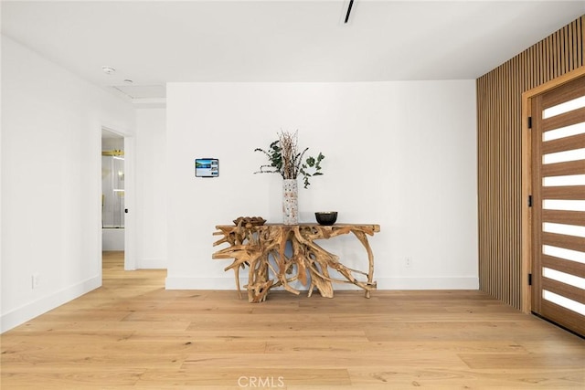 entrance foyer featuring light wood-style floors and baseboards