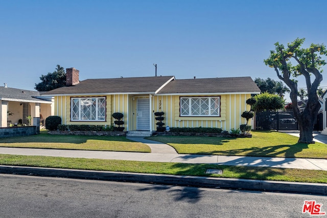 ranch-style house with a front yard