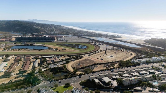 bird's eye view featuring a view of the beach and a water view