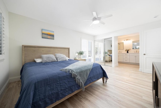 bedroom with ceiling fan, light hardwood / wood-style floors, connected bathroom, and a closet