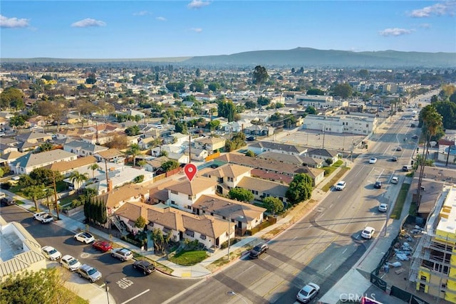 birds eye view of property with a mountain view