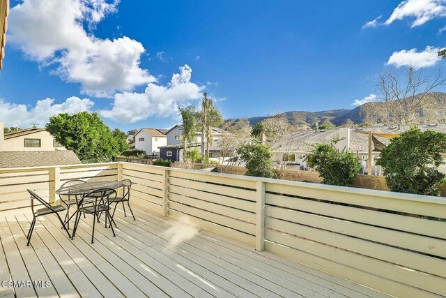 wooden terrace featuring a mountain view