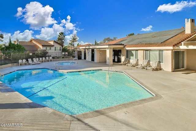 view of swimming pool featuring a patio