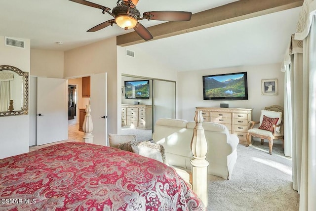 bedroom featuring beam ceiling, ceiling fan, and light colored carpet