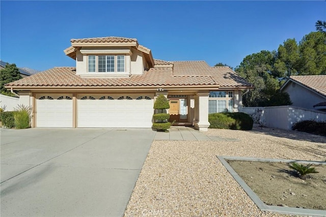 mediterranean / spanish-style home featuring a garage