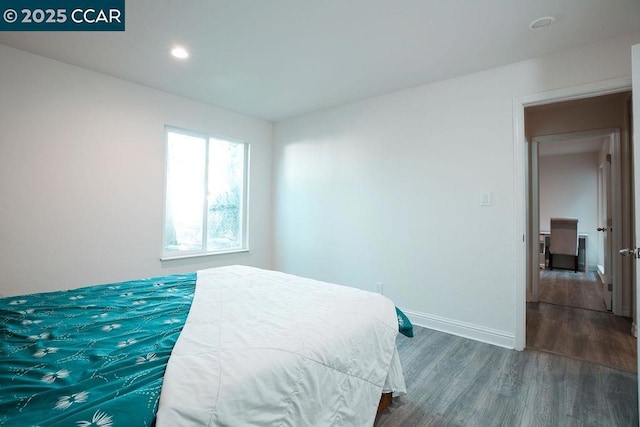 bedroom featuring dark hardwood / wood-style floors