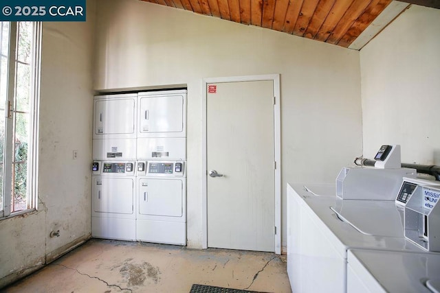 washroom featuring separate washer and dryer, stacked washer and clothes dryer, and wood ceiling