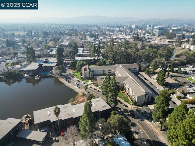 aerial view featuring a water and mountain view