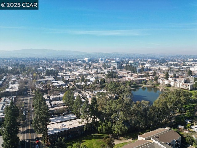 drone / aerial view with a water and mountain view