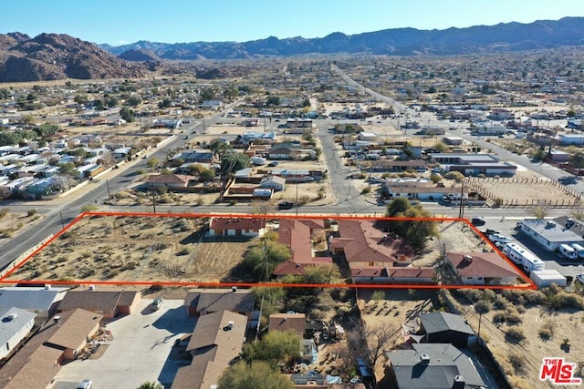 bird's eye view with a mountain view