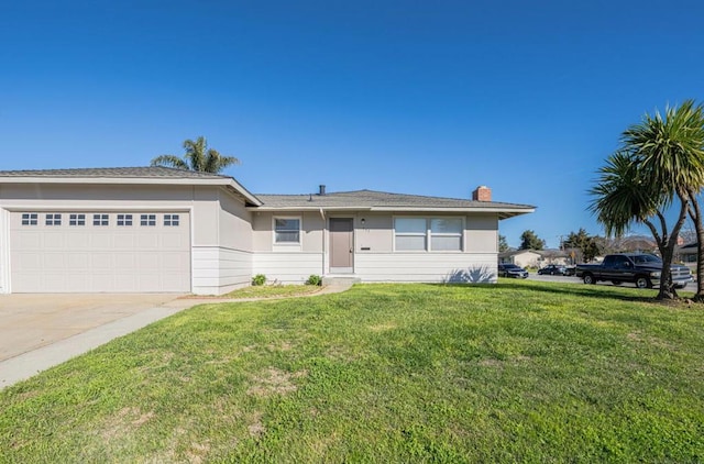 ranch-style house with a front yard and a garage