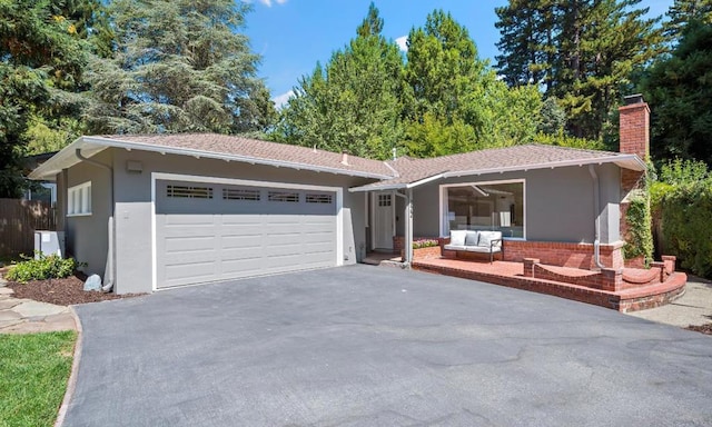 single story home featuring a garage