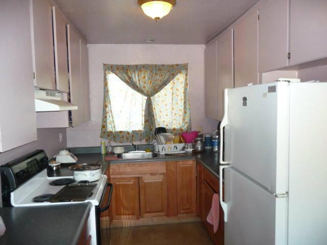 kitchen featuring sink and white appliances