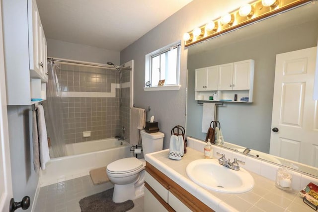 full bathroom featuring tile patterned flooring, vanity, toilet, and shower / bath combo with shower curtain