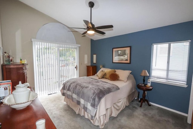 carpeted bedroom featuring vaulted ceiling, access to outside, and ceiling fan