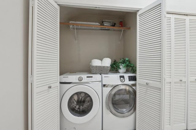 washroom with independent washer and dryer