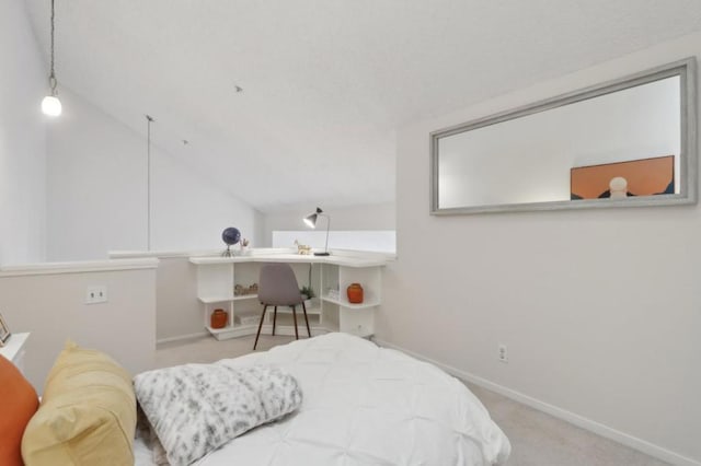 carpeted bedroom with lofted ceiling