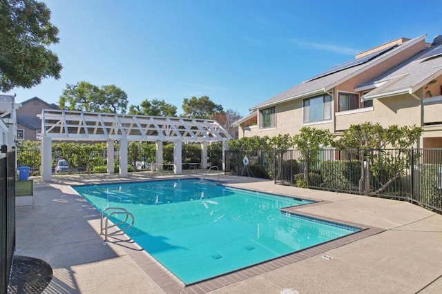 view of pool featuring a patio and a pergola