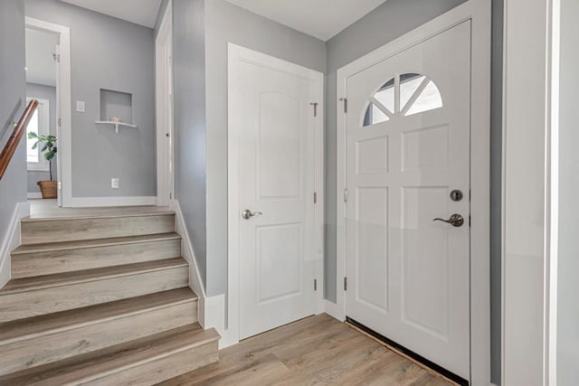 foyer entrance with plenty of natural light and light hardwood / wood-style floors