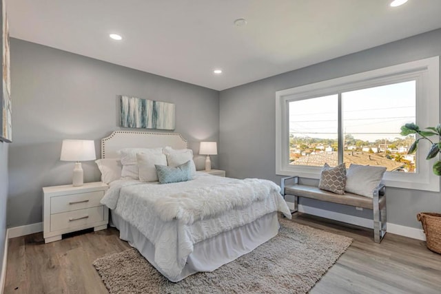 bedroom with light hardwood / wood-style flooring