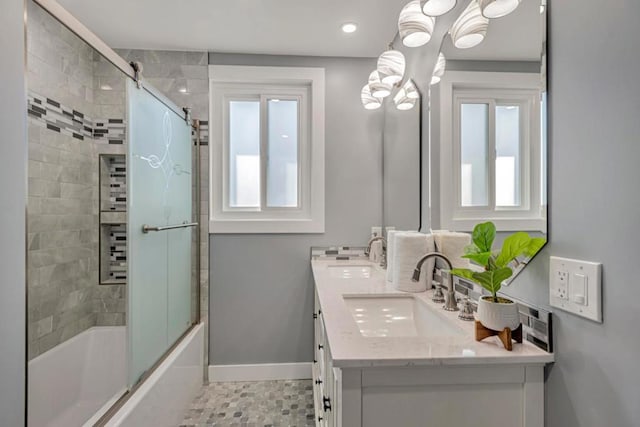 bathroom with combined bath / shower with glass door, tile patterned floors, and vanity