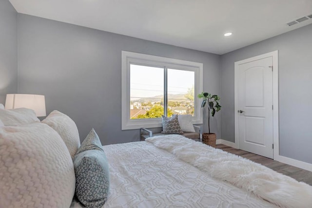 bedroom featuring hardwood / wood-style floors