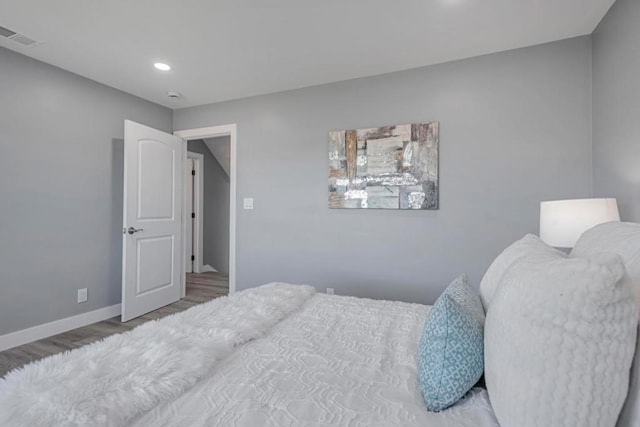 bedroom featuring hardwood / wood-style floors