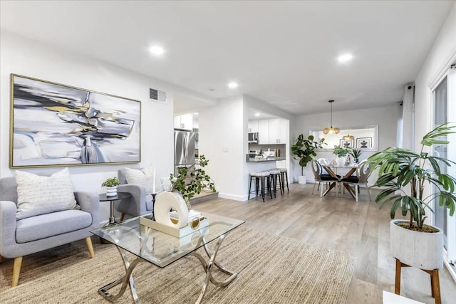 living room with light hardwood / wood-style floors