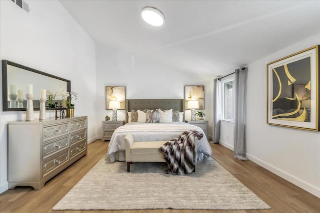 bedroom with light hardwood / wood-style floors