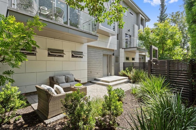 back of house featuring an outdoor hangout area