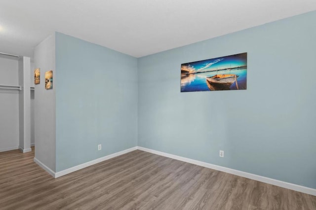 unfurnished room featuring wood-type flooring